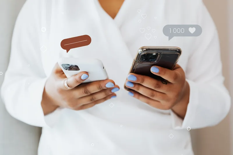 A person reading through enthusiastic social media comments on their phone