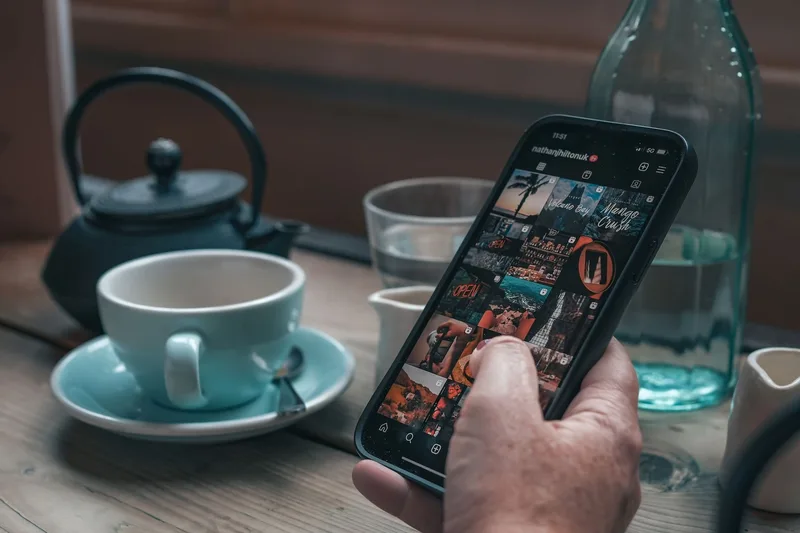 A creator reviewing Instagram Stories poll results on a phone, showing bar graphs with response percentages after a 24-hour poll period