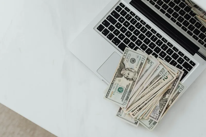 A laptop screen showing a simple Stripe dashboard with three recent payments labeled &ldquo;early access deposit&rdquo; — each $19, each from a different customer, timestamped before any product was shipped