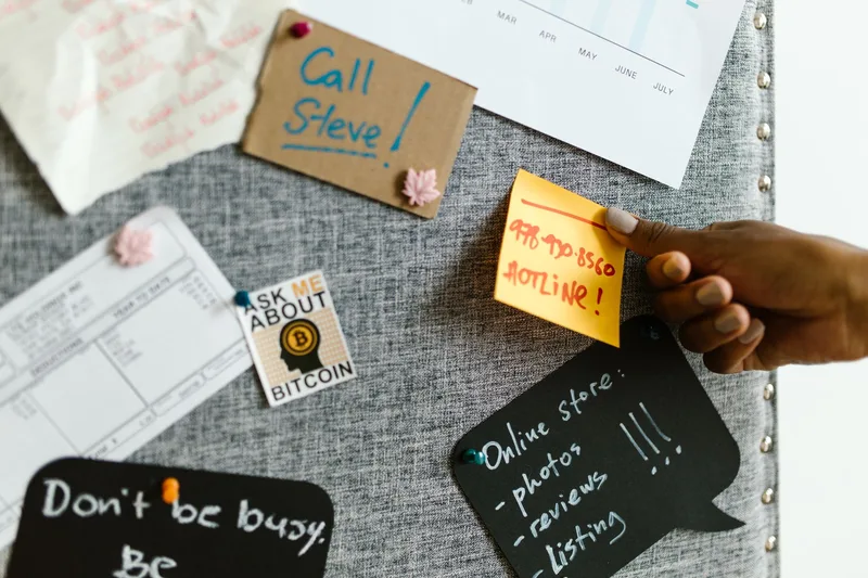 A bulletin board covered in pinned notes, the kind of manual sorting exercise that helps separate strong signals from weak ones when the evidence points in different directions
